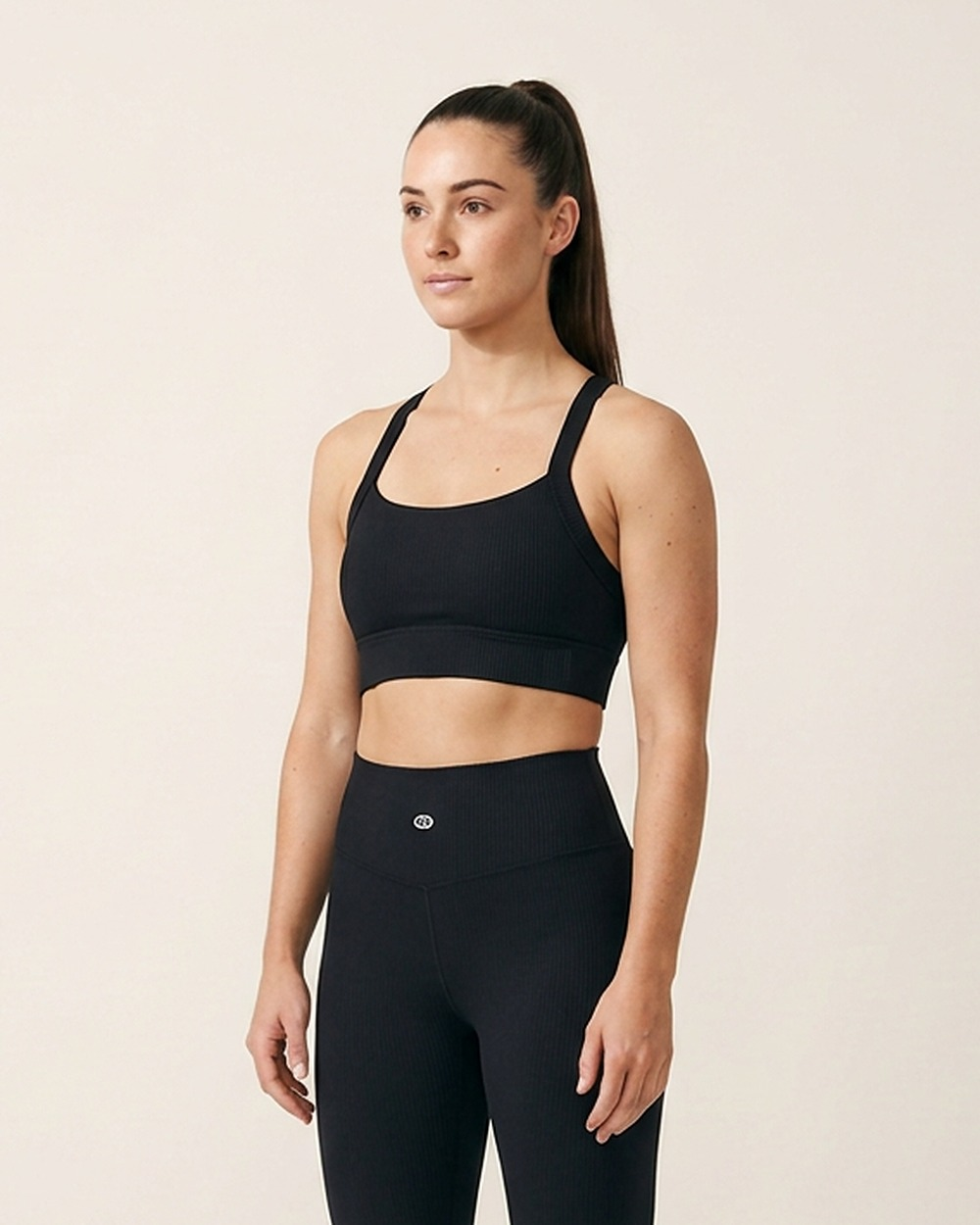Cross Back Sports Bra by The Cave Gym worn by model