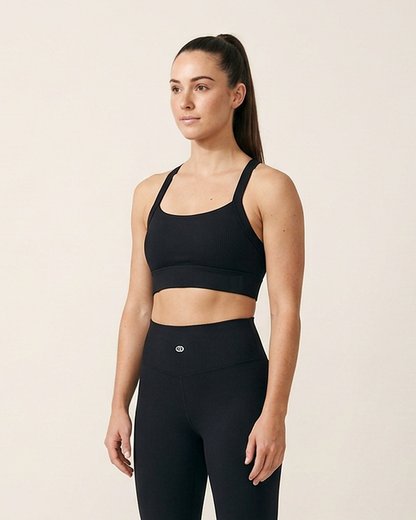 Cross Back Sports Bra by The Cave Gym worn by model