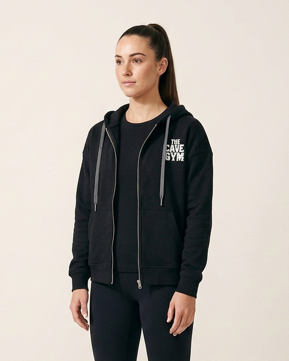 Zip Up Hoodie by The Cave Gym worn by model