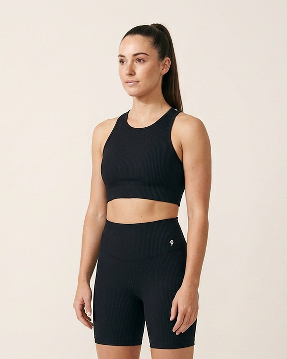 Racer Back Sports Bra by The Cave Gym worn by model